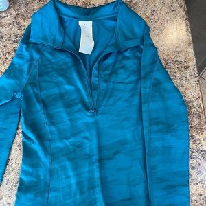 New! UnderArmour fitted long sleeve half zip Top.